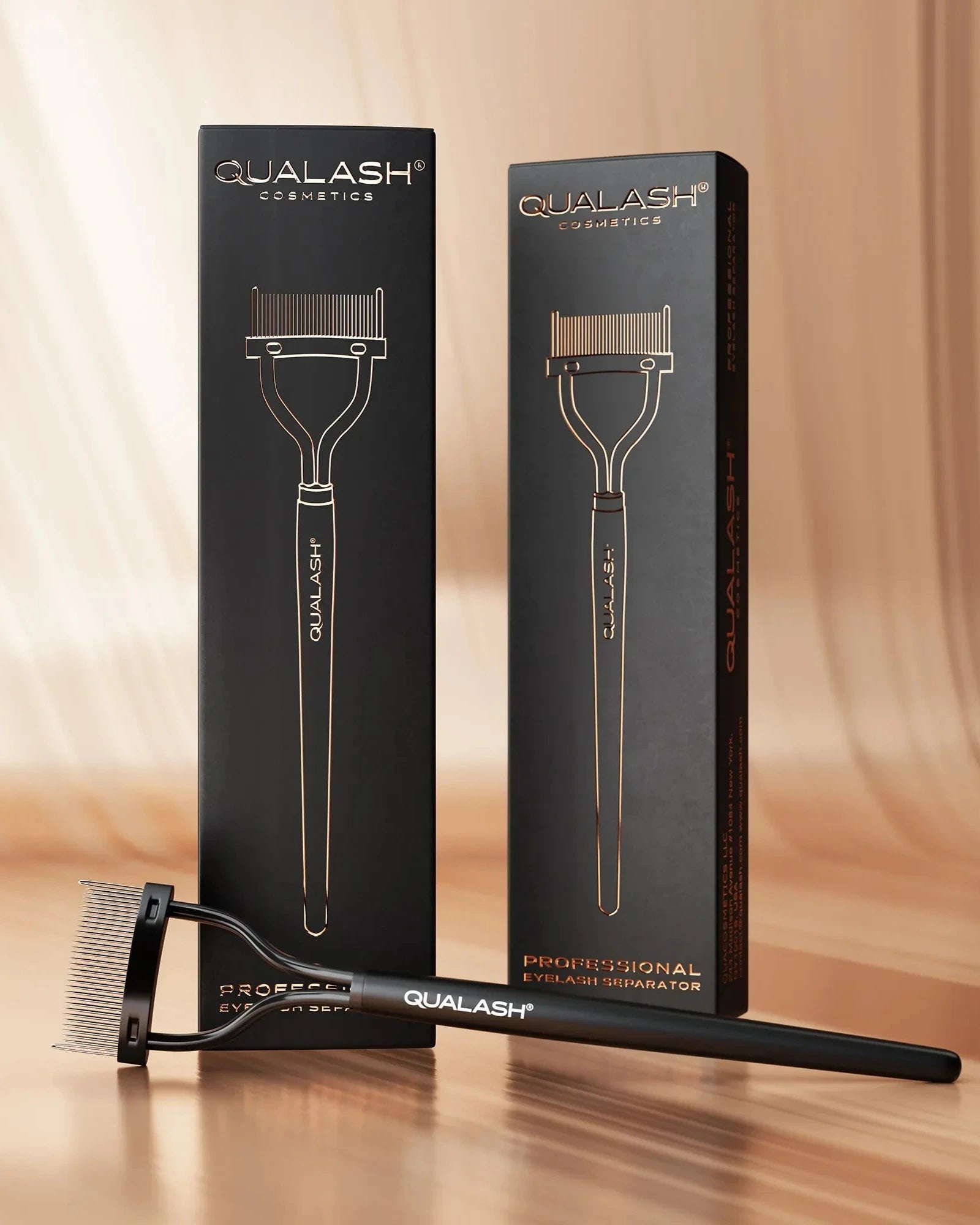 QUALASH Eyelash Separator – lifestyle image with packaging on elegant backdrop